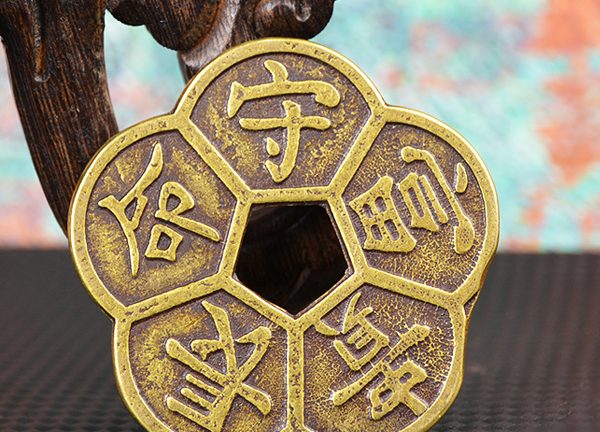 What are the feng shui functions of the Plum Blossom Coins?